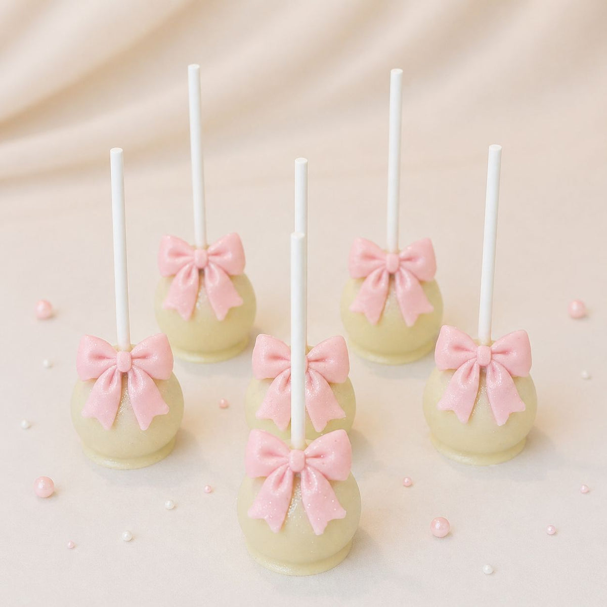 CAKE POP NOEUD ROSE atelierdesgateaux.com 